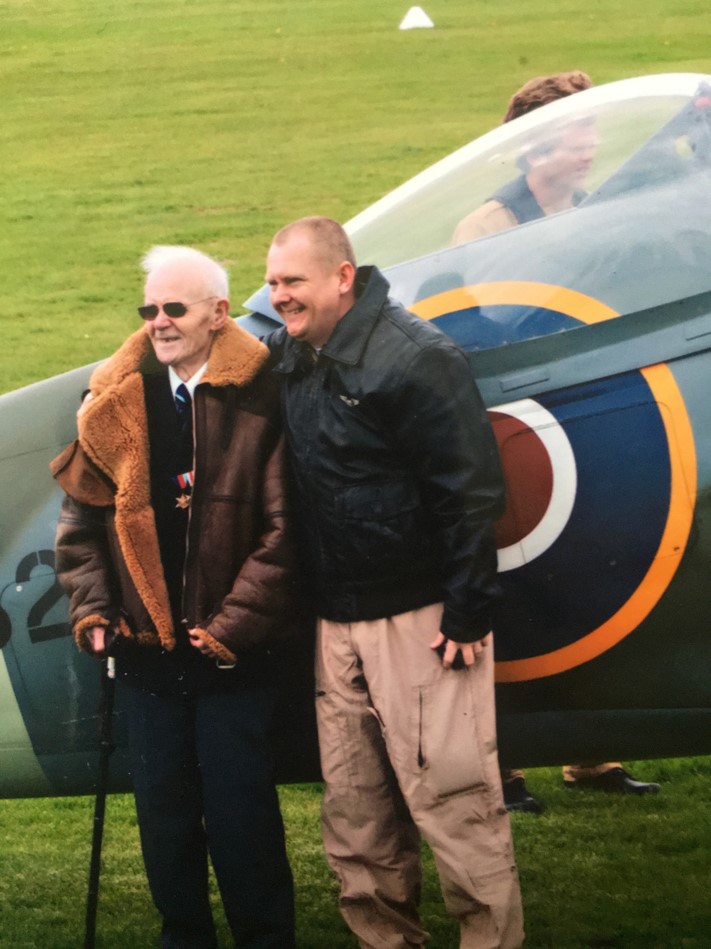 Spitfire engineer in front of a Two seat Spitfire TR9