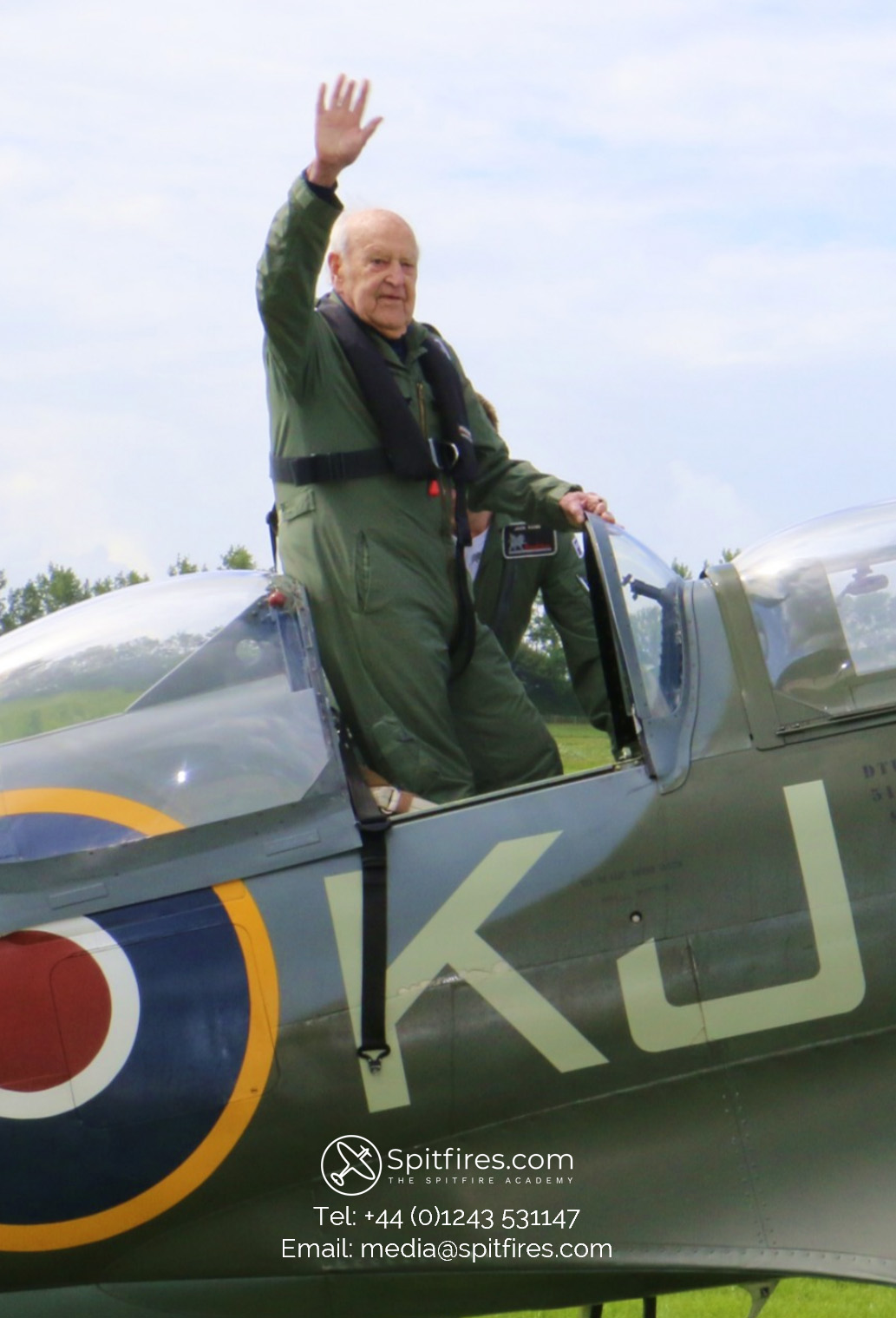 Owen Hardy waves after a spitfire flight experience in a two seat spitfire